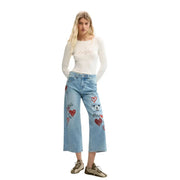 Desigual women light blue cotton denim jeans with wide legs, red heart patches, and mickey mouse appliqué