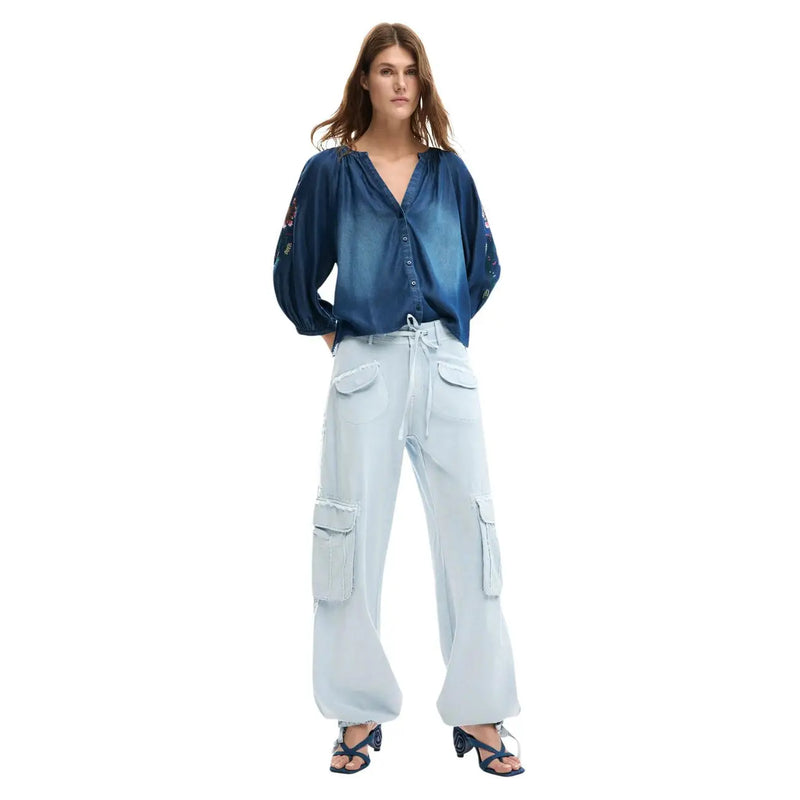 Blue denim blouse with embroidered sleeves and button-front design paired with Desigual women light blue cotton trousers with laces