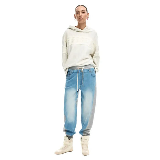 Cream-colored fila hoodie with relaxed fit and subtle logo paired with desigual women light blue lace detail jeans