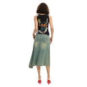 Desigual women sleeveless black top with vibrant floral and abstract design paired with light-wash denim skirt