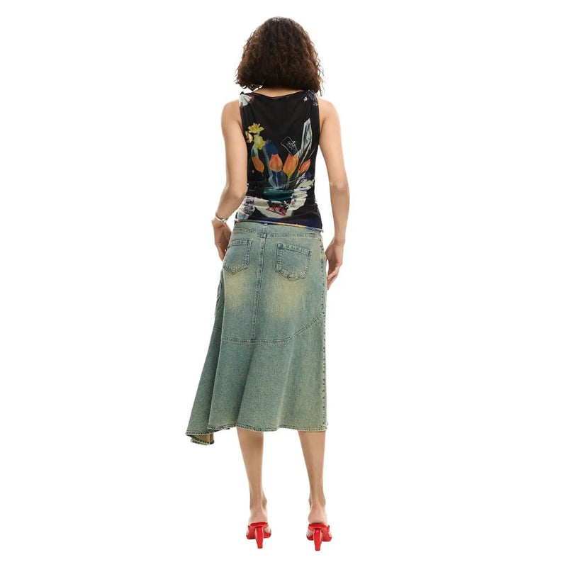 Desigual women sleeveless black top with vibrant floral and abstract design paired with light-wash denim skirt