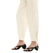 Cream-colored tapered cotton trousers by desigual with lace-up cuffs and front and back pockets for women