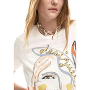 Silver sculptural choker necklace with flowing wave-like curves worn with desigual women white cotton round neck short t shirt