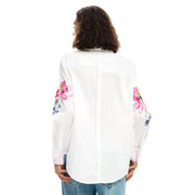 Desigual women white cotton long shirt with round neck featuring vibrant pink and blue floral embroidery on sleeves