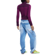 Wide-leg light blue denim jeans with patch pockets paired with desigual women’s fuchsia zip turtleneck cardigan