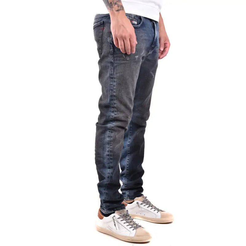 Diesel men jeans in dark blue worn out effect with slim fit and distressed details made of 100 cotton