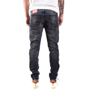 Back side of dark-wash diesel men jeans with blue worn out effect made from 100 cotton featuring distressed look