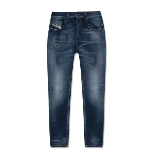 Diesel men jeans in dark blue cotton lyocell with a worn out effect featuring distressed and subtle fading details