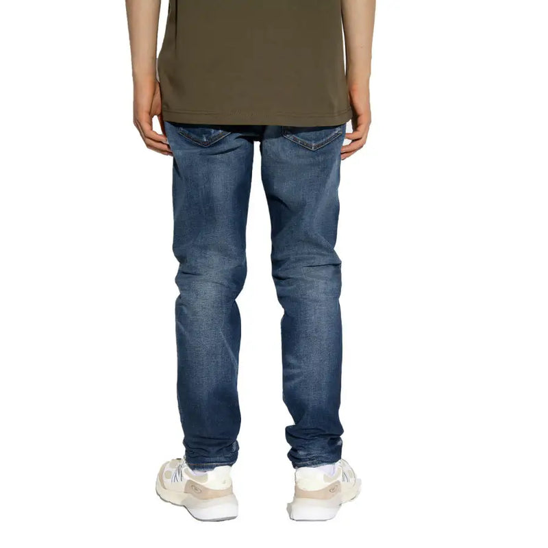 Diesel men jeans blue slim fit dark wash with worn out effect cotton lyocell worn by person in olive green t-shirt