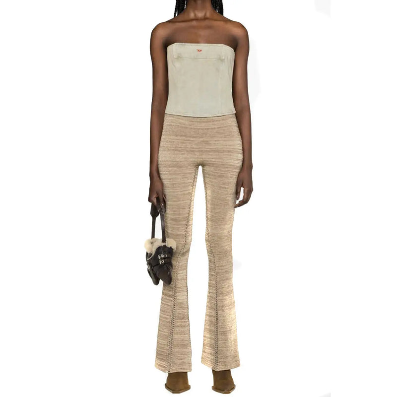 Beige textured knit flare pants styled with diesel women light blue cotton top from spring summer collection