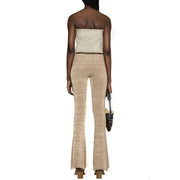 Beige textured knit flare pants with ribbed slightly shimmering finish paired with diesel women light blue cotton top