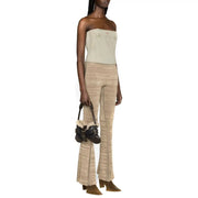 Black leather mini bag with shearling lining and buckle details paired with Diesel women light blue cotton top