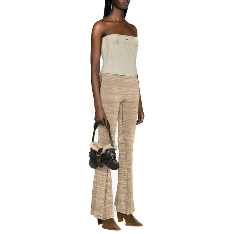 Black leather mini bag with shearling lining and buckle details paired with Diesel women light blue cotton top