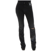 Diesel Zerrissene schwarze Baumwolljeans für Damen, die die Rückseite mit ausgefransten Knien und einem Markenaufnäher an der Tasche zeigen.
