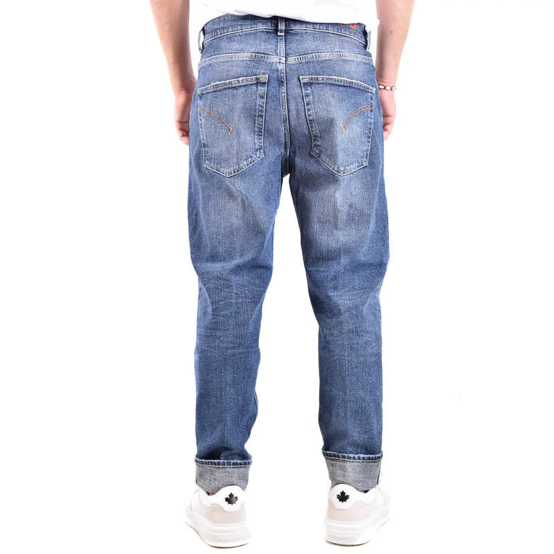 Dondup jeans for men in blue denim with faded wash and rolled cuffs, front view