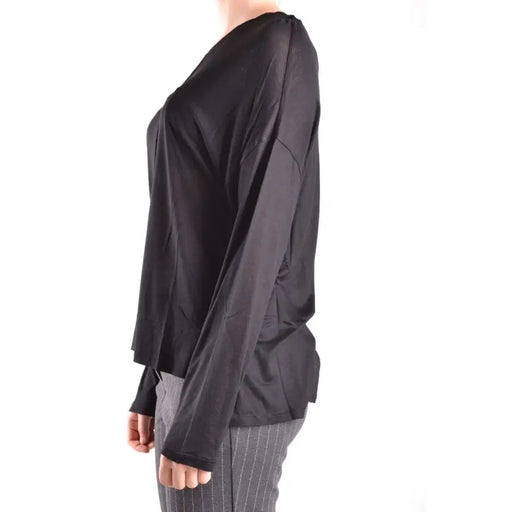 Black long-sleeved V-neck top paired with striped trousers from Dondup Women collection