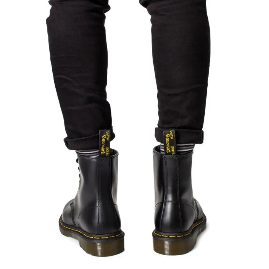 
                      
                        Black Dr. Martens boots showcasing urban city style fashion
                      
                    