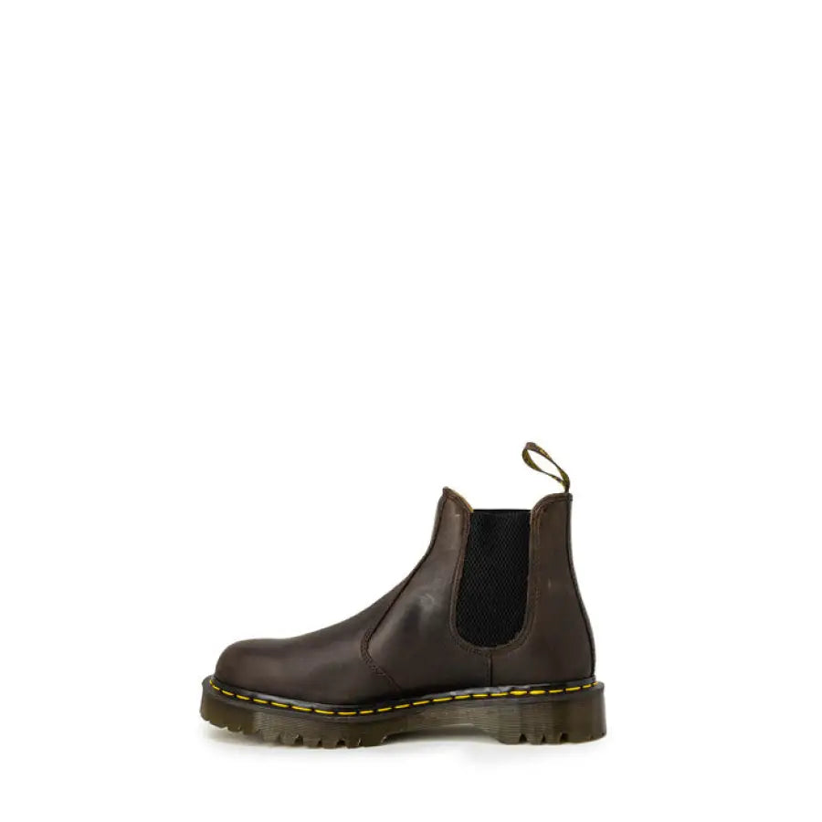 
                      
                        Dark brown Dr. Martens Chelsea boots showcasing urban city style fashion
                      
                    