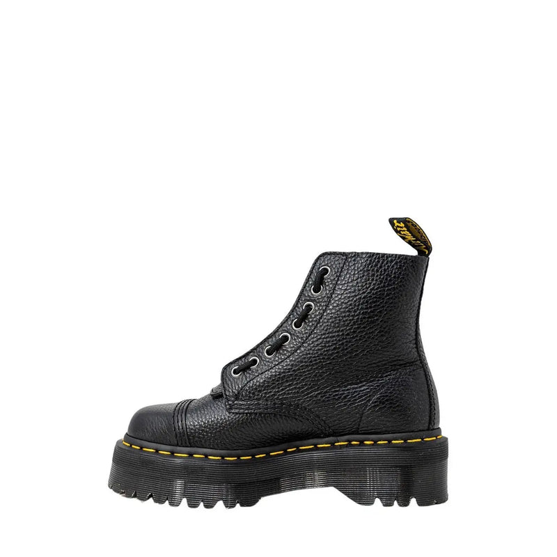 Dr martens black leather ankle boots for women showing the textured leather upper from the back side