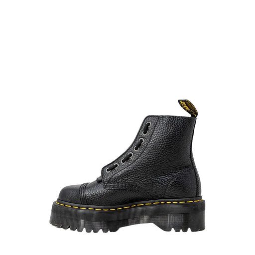 Dr martens black leather ankle boots for women showing the textured leather upper from the back side