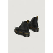 Schwarze Dr. Martens Leder-Ankle-Boots für Damen, von hinten gezeigt, wobei die Lederstruktur hervorgehoben wird.