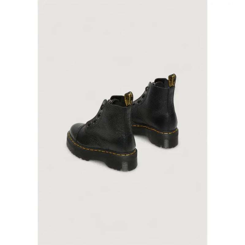 Schwarze Dr. Martens Leder-Ankle-Boots für Damen, von hinten gezeigt, wobei die Lederstruktur hervorgehoben wird.