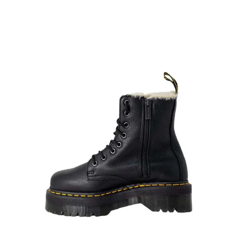 Black leather dr martens ankle boots for women shown from the back side highlighting durable leather material