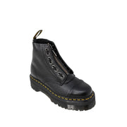Black leather ankle boots for women by dr martens shown from the back side with a sleek design
