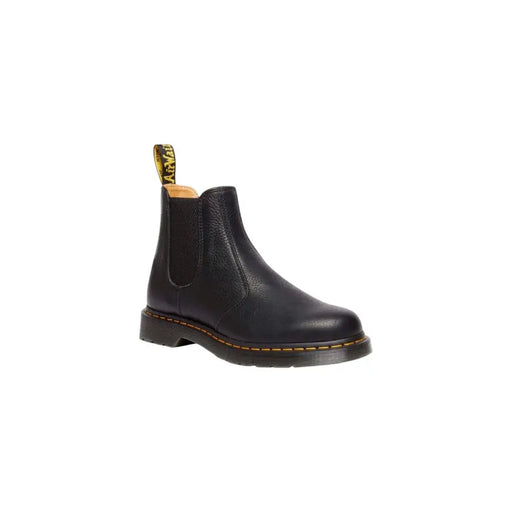 Dr. Martens Herren-Lederstiefeletten, schwarz mit gelben Ziernähten und Zuglasche, von der Rückseite gesehen