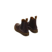 Dunkelbraune Dr. Martens Herren-Lederstiefel, Modell Classic 2976, mit gelben Ziernähten und Chelsea-Design