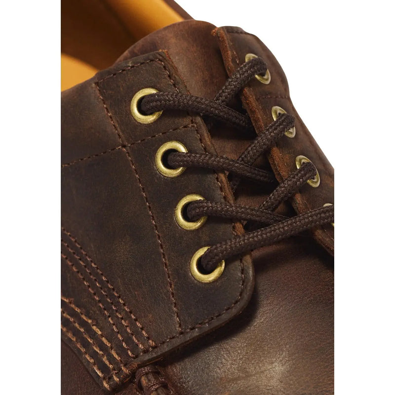 Braune Dr. Martens Herren-Schnürstiefel aus Leder mit dunkelbraunen Schnürsenkeln und messingfarbenen Ösen