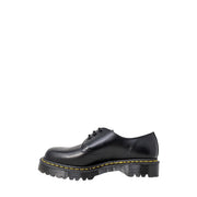 Dr Martens men’s black leather lace-up shoes showing the back side with durable stitching and heel loop