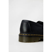 Black leather dr martens mens slip on shoes showing the back side suitable for fall winter wear