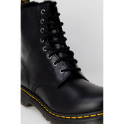 Dr Martens women black leather boots showing the back side designed for fall and winter use