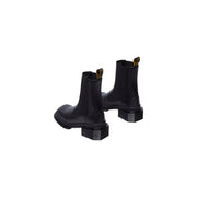 Dr Martens women black leather Chelsea boots showing the back side with signature pull tab and sturdy sole