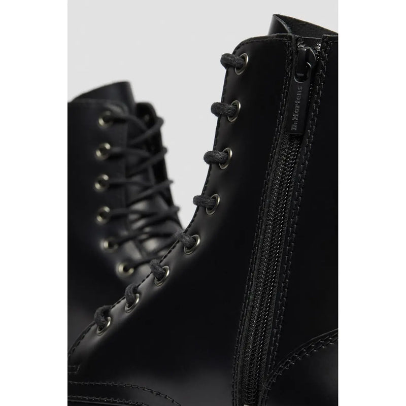 Dr Martens women black leather lace boots size 4 shown from the back side highlighting the sturdy heel design