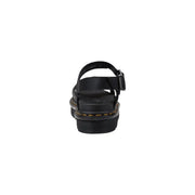 Dr Martens women black leather platform sandals with thick sole, adjustable buckle strap, and signature yellow stitching