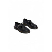 Dr martens women black leather slip on shoes shown from the back side featuring smooth leather finish