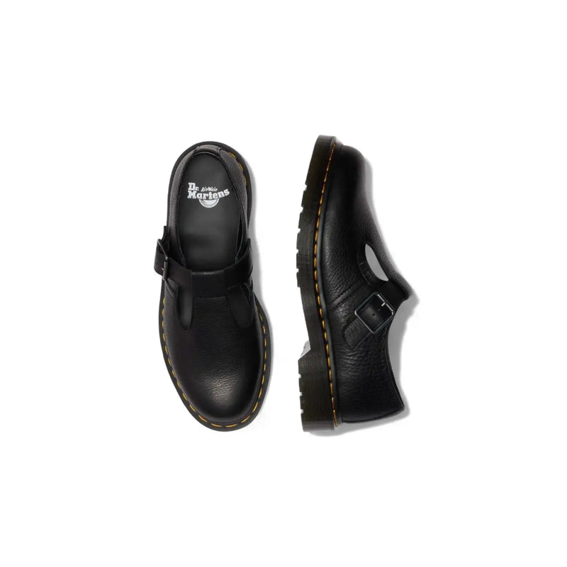 Dr Martens women black leather slip on shoes shown from the back with smooth black leather and slip on design