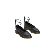 Dr Martens women black leather slip on mary jane shoes with lace up ankle straps and yellow stitched sole