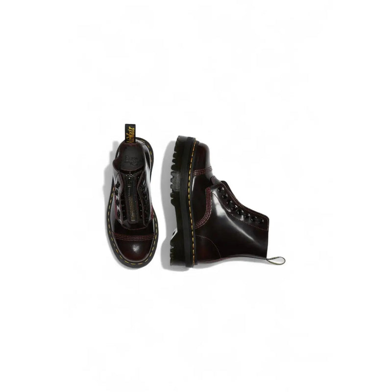 Dark burgundy leather platform boots by dr martens for women shown from the back side