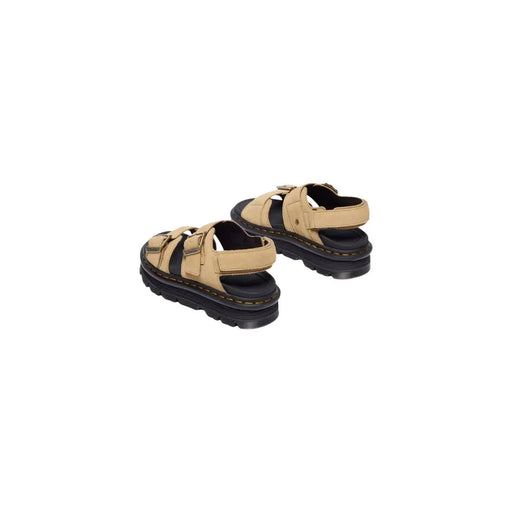 Dr Martens women tan leather buckle sandals with black rubber soles and adjustable straps shown from the back side
