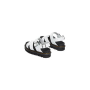 Dr martens women white leather voss ii sandals with black rubber soles and silver buckles front view