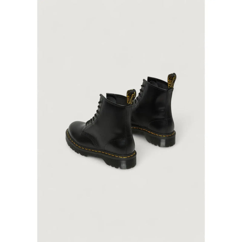 Dr Martens women’s black leather ankle boots shown from the back side, ideal for fall and winter wear