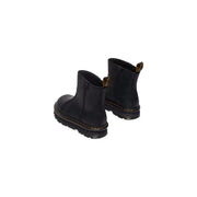 Dr Martens women’s black leather ankle boots showing the back side with durable stitching and heel loop