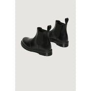 Dr. Martens women’s black leather chelsea boots with elastic side panels and chunky rubber sole for fall winter