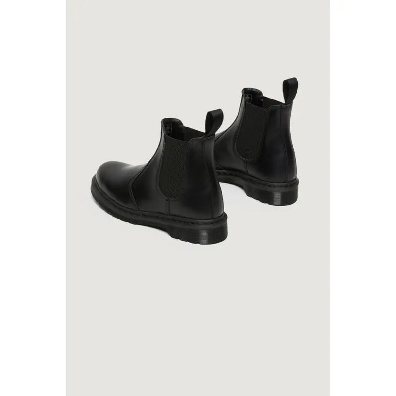 Dr. Martens women’s black leather chelsea boots with elastic side panels and chunky rubber sole for fall winter