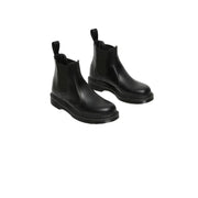 Dr Martens women’s black leather chelsea boots with elastic side panels and chunky rubber sole for fall winter