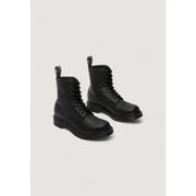 Dr Martens women’s black leather boots showing the back side with signature heel loop and sturdy sole