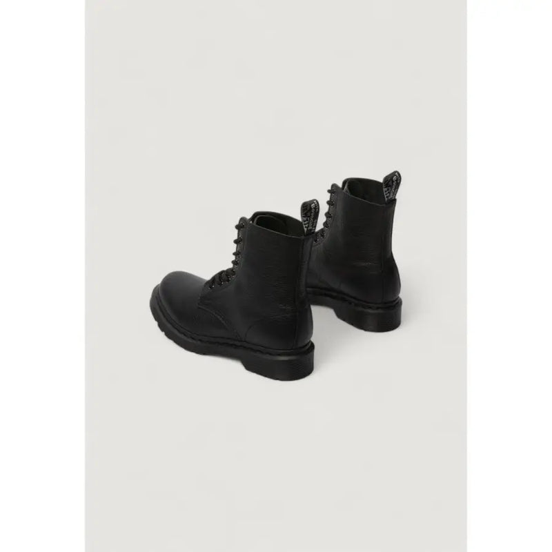 Dr Martens women’s black leather boots showing the back side with smooth leather and sturdy construction